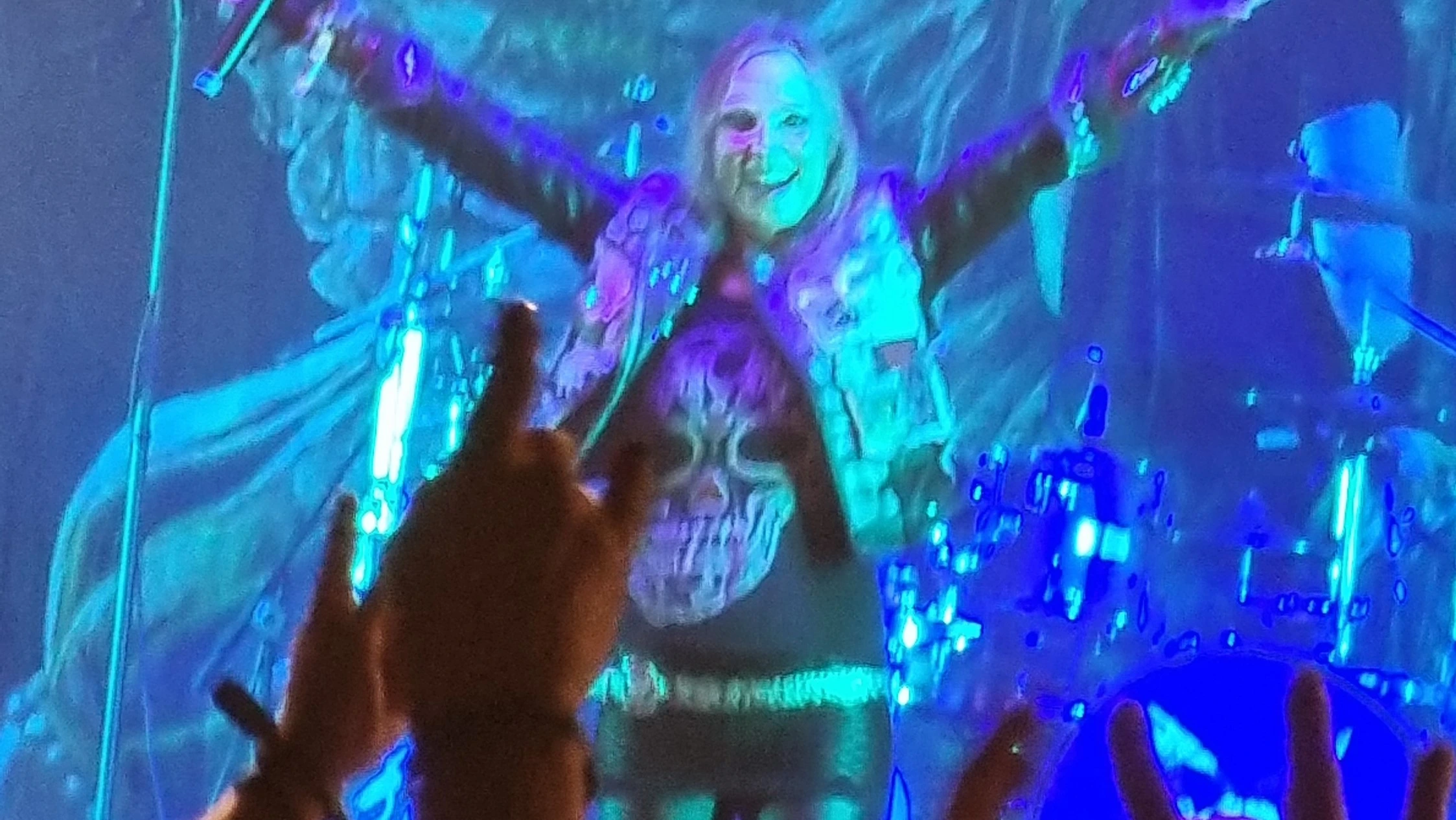 In a thunderous storm of metal fervor, Holy Moses roared to life at Wacken Open Air 2023, leaving an indelible mark on the iconic festival's history. The revered German thrash metal pioneers took the stage by storm, and the sheer intensity of their performance reverberated throughout the mesmerized crowd, embodying the very essence of the genre that has fueled their journey for decades. A Thrash Metal Onslaught As the crowd eagerly anticipated the appearance of Holy Moses, the atmosphere crackled with anticipation. Then, in a blaze of energy and ferocity, the band burst onto the stage, opening their set with "Def Con II." The roaring guitars and thunderous drumming set the tone for what would be a relentless barrage of classic thrash anthems that spanned their illustrious career. A Setlist to Remember Their setlist at Wacken 2023 was a carefully crafted collection of their most iconic tracks, each song a testament to their influence and longevity in the world of metal: Def Con II Panic SSP (Secret Service Project) Near Dark Invisible Queen Cult of the Machine Nothing for My Mum World Chaos Jungle of Lies Hellhound Undead Dogs Finished with the Dogs Life's Destroyer Current of Death Each song was a sonic assault on the senses, fueled by the raw energy and unmistakable stage presence of Holy Moses. "Hellhound" and "Undead Dogs" sent shockwaves through the crowd, while the crowd-pleasing "Finished with the Dogs" showcased the band's ability to create anthems that transcend time. Metal Legacy and Unbreakable Spirit With decades of experience under their belts, Holy Moses showcased not only their technical mastery but also their connection with their fans. The crowd's response was a testament to the band's enduring legacy, with metalheads of all ages raising their horns in unison, paying homage to the trailblazers who have paved the way for generations of metal musicians. A Fitting Tribute to Metal Resilience In the midst of the electric atmosphere, the performance of "Current of Death" felt like a poignant reminder of the journey that metal, and Holy Moses in particular, has undertaken. The resilience, the camaraderie, and the unyielding passion of both the band and the audience were tangible, culminating in a performance that transcended the stage and transformed into an unforgettable metal experience. Conclusion: The Legend Lives On Holy Moses' live performance at Wacken 2023 was a testament to their enduring legacy and their undying commitment to the spirit of metal. From the explosive opening chords to the last note that echoed through the night, they reignited the flames of metal within the hearts of all who bore witness. As the final chords of "Current of Death" faded into the night, the memory of Holy Moses' triumphant performance remains etched in the annals of Wacken's history, a testament to the power of music and the unbreakable bond that ties metalheads together.