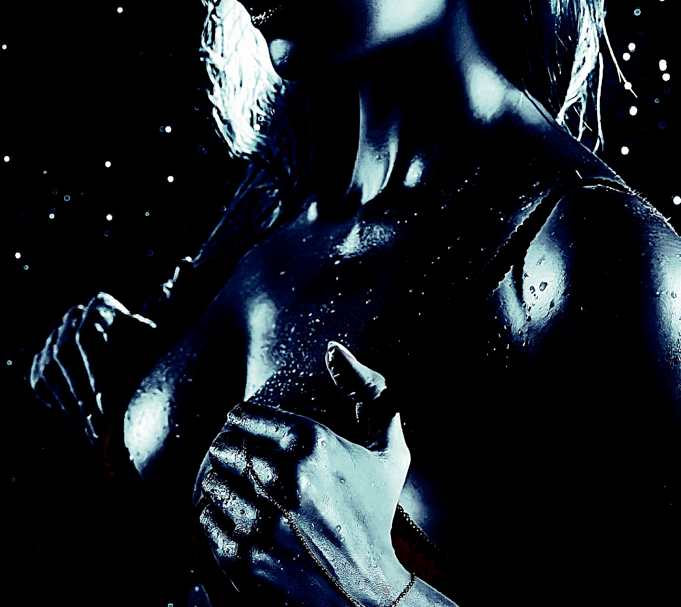 Wet skin glistening in a dark, moody setting suggestive of a gothic or noir aesthetic.