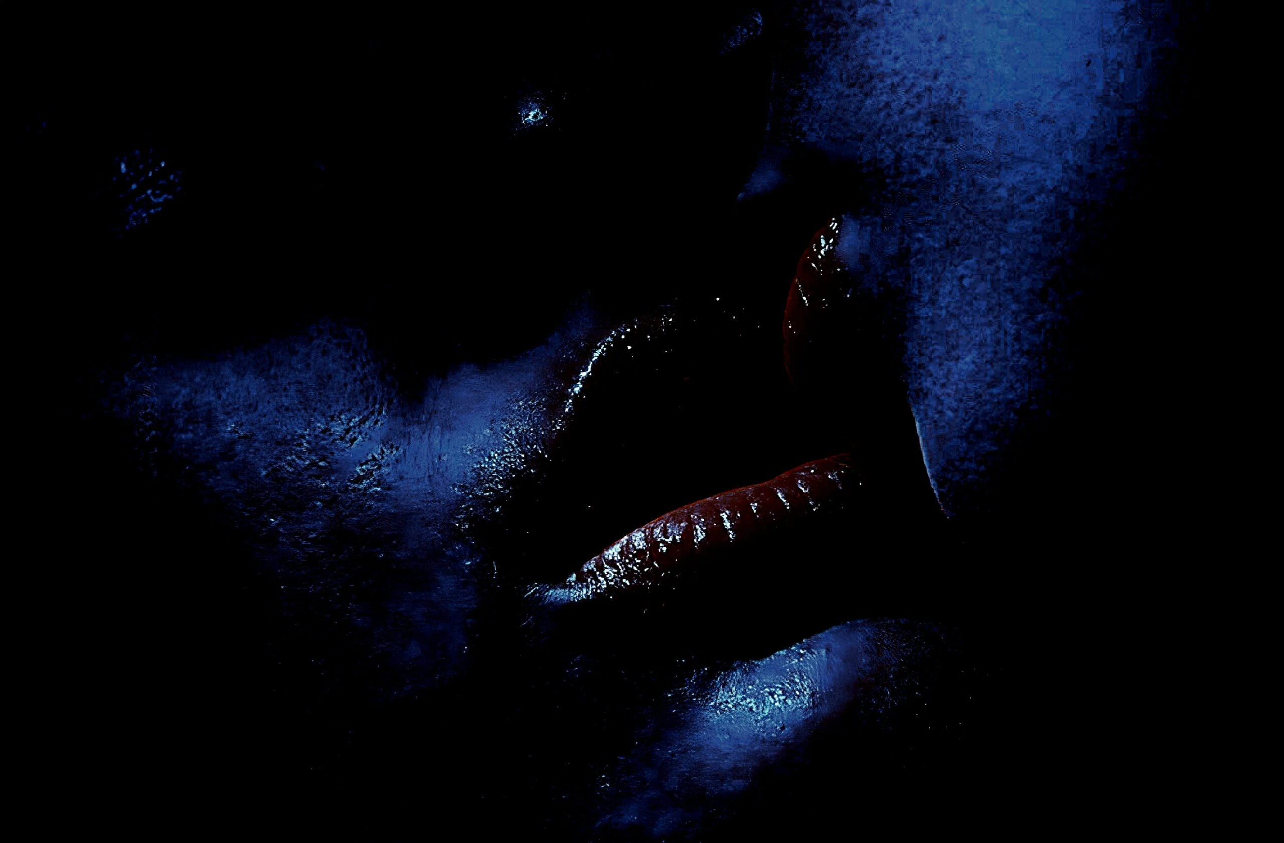 Close-up of lips in a suggestive pose, hinting at a lesbian gothic narrative.