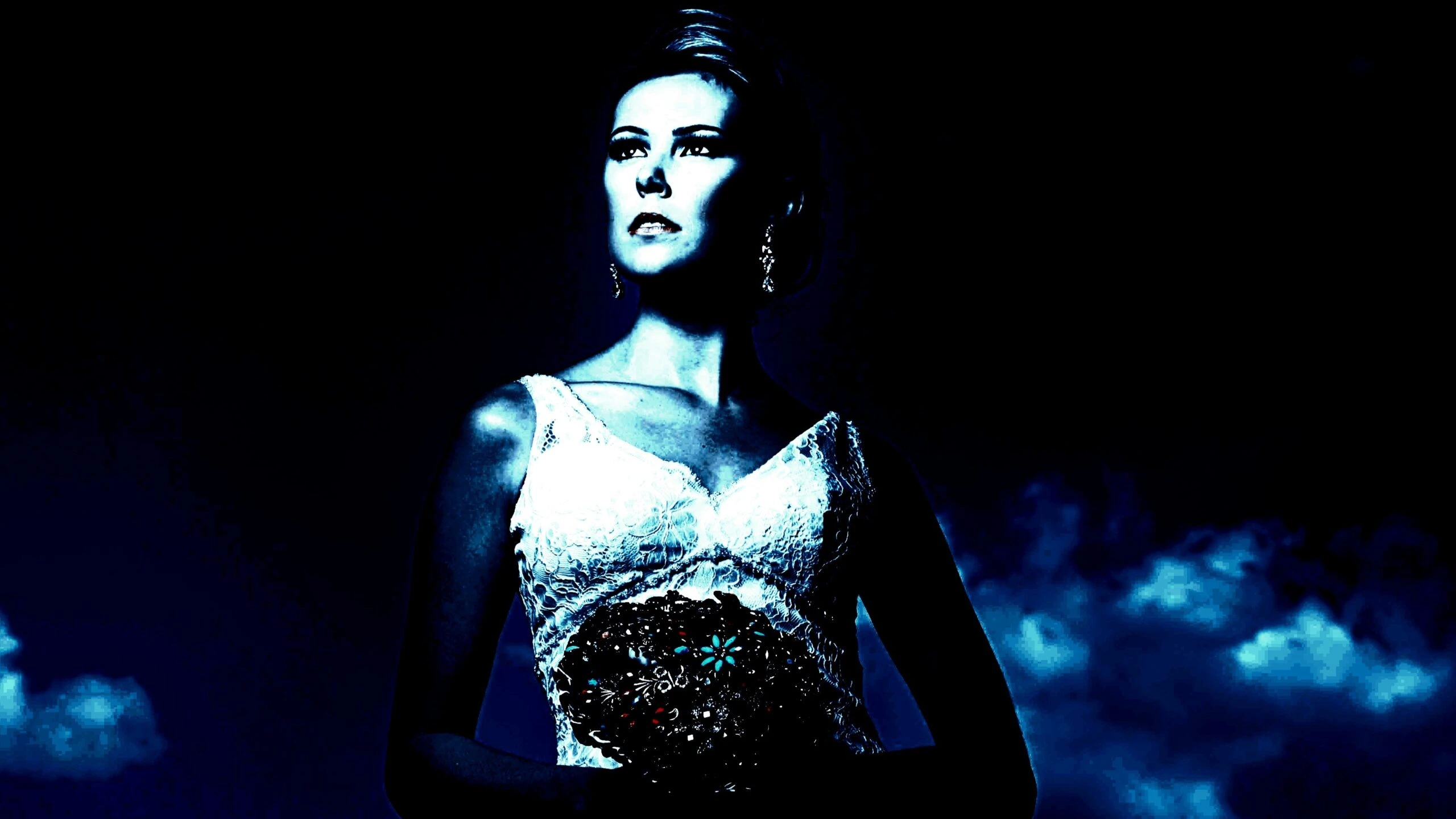 A gothic bride in an elegant dress, imbued with the essence of gothic wedding dresses, stands under a moonlit sky that casts an enigmatic blue glow, highlighting her contemplative expression and intricate lace details.