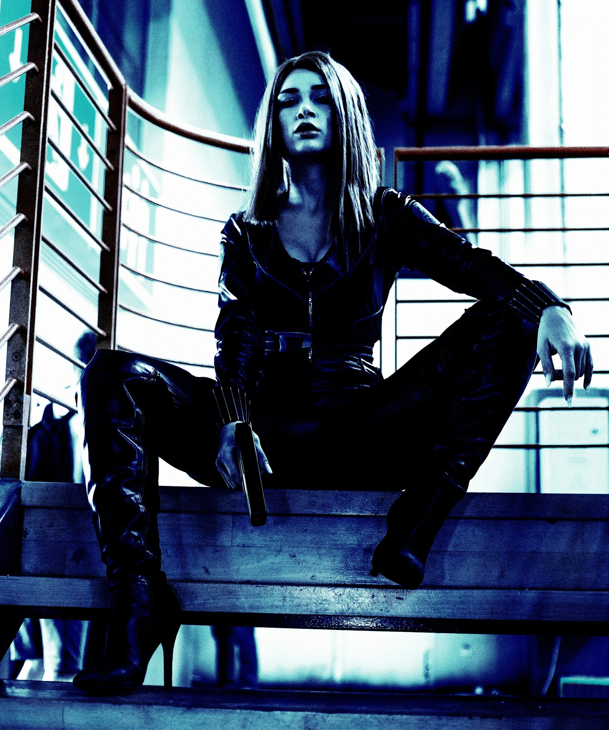 Cosplayer dressed in an intricate black and white outfit, striking a dynamic pose with a white gloved hand extended, under a high-contrast blue filter.