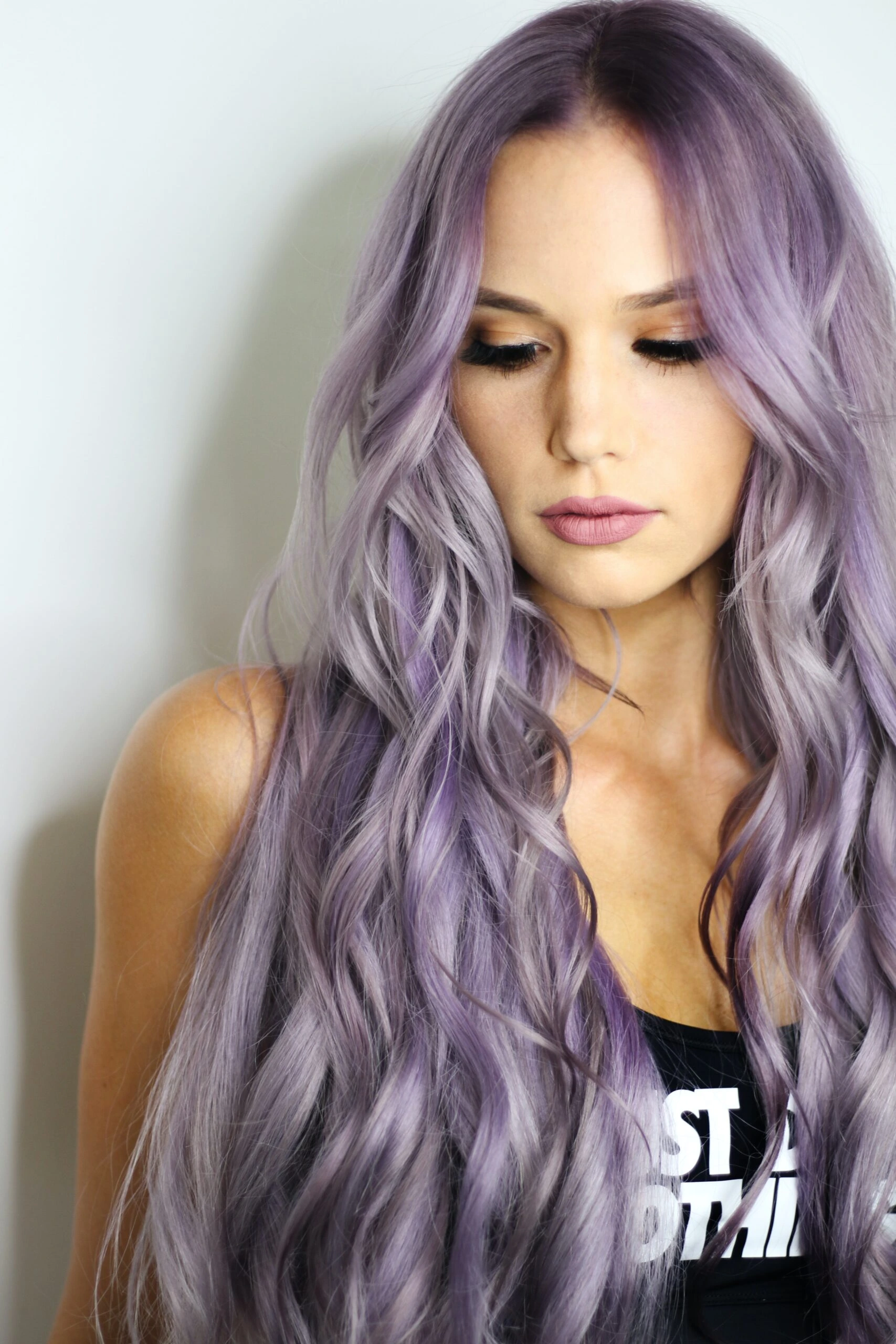 Woman with lavender hair, embodying individuality and defying 'red flags in a woman' stereotypes.