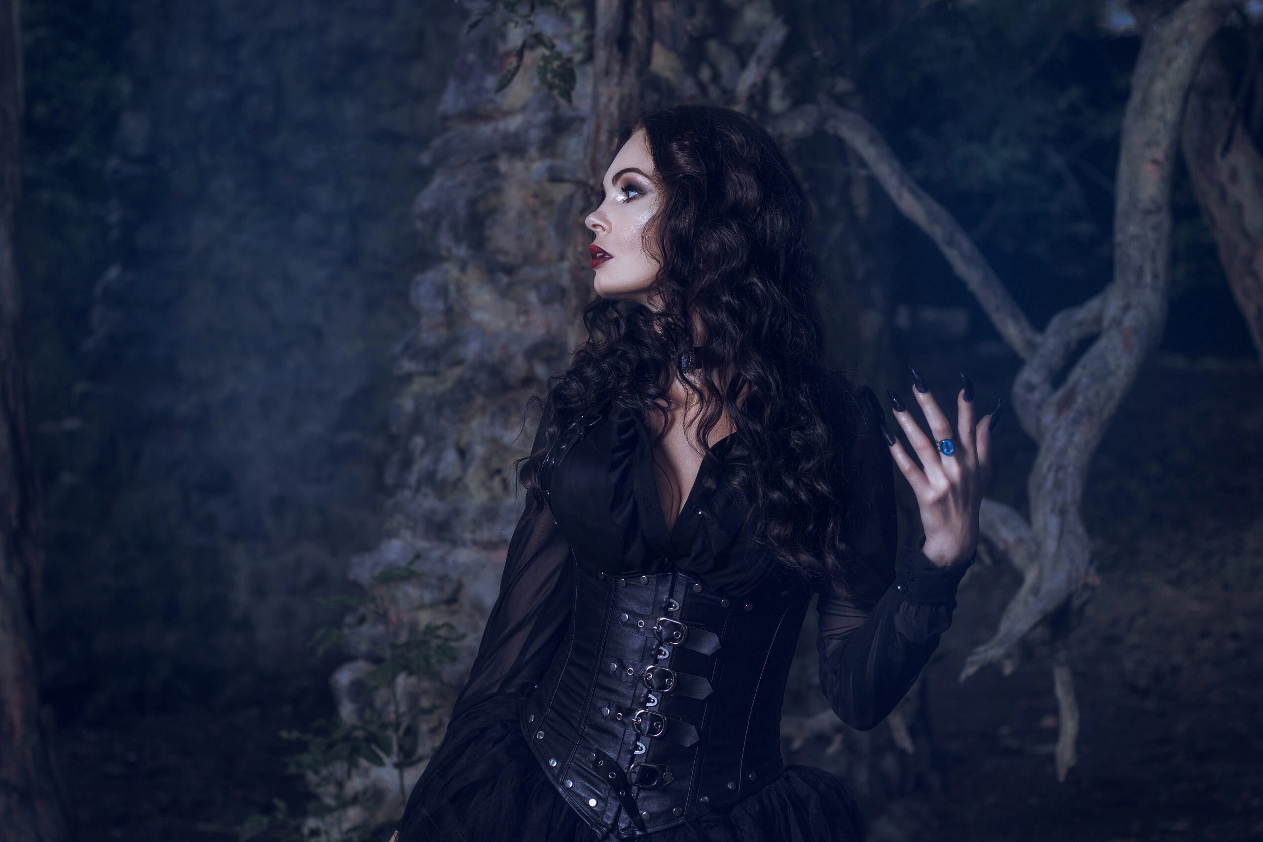 A Deep Dive into Timeless Fashion: Mysterious gothic lady in dark Victorian attire, gazing into the night with a dramatic pose.