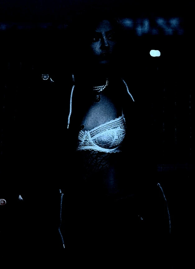 Mysterious gothic woman posing in the forest.