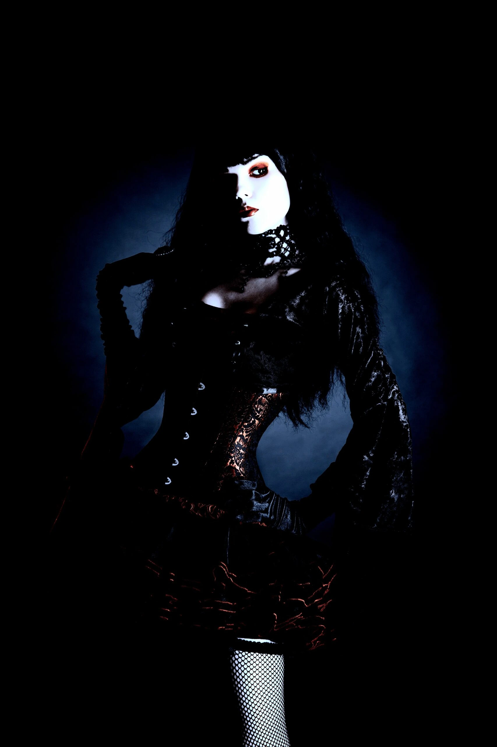 Gothic model in a dark, Victorian-inspired corset and lace ensemble, evoking a mysterious aura.