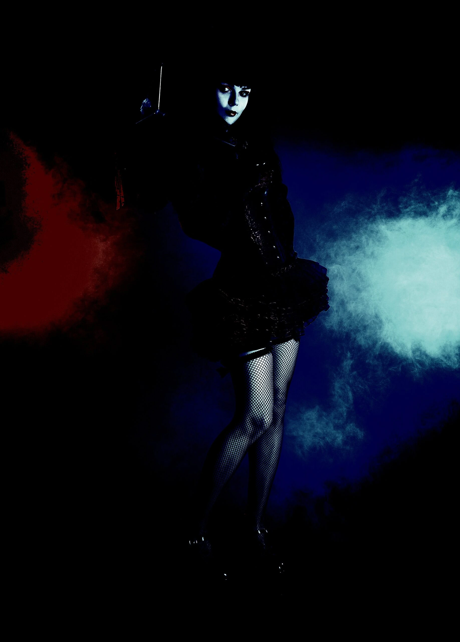 Gothic woman in a dark setting holding a sword, part of the Ultimate Gothic Ensemble.