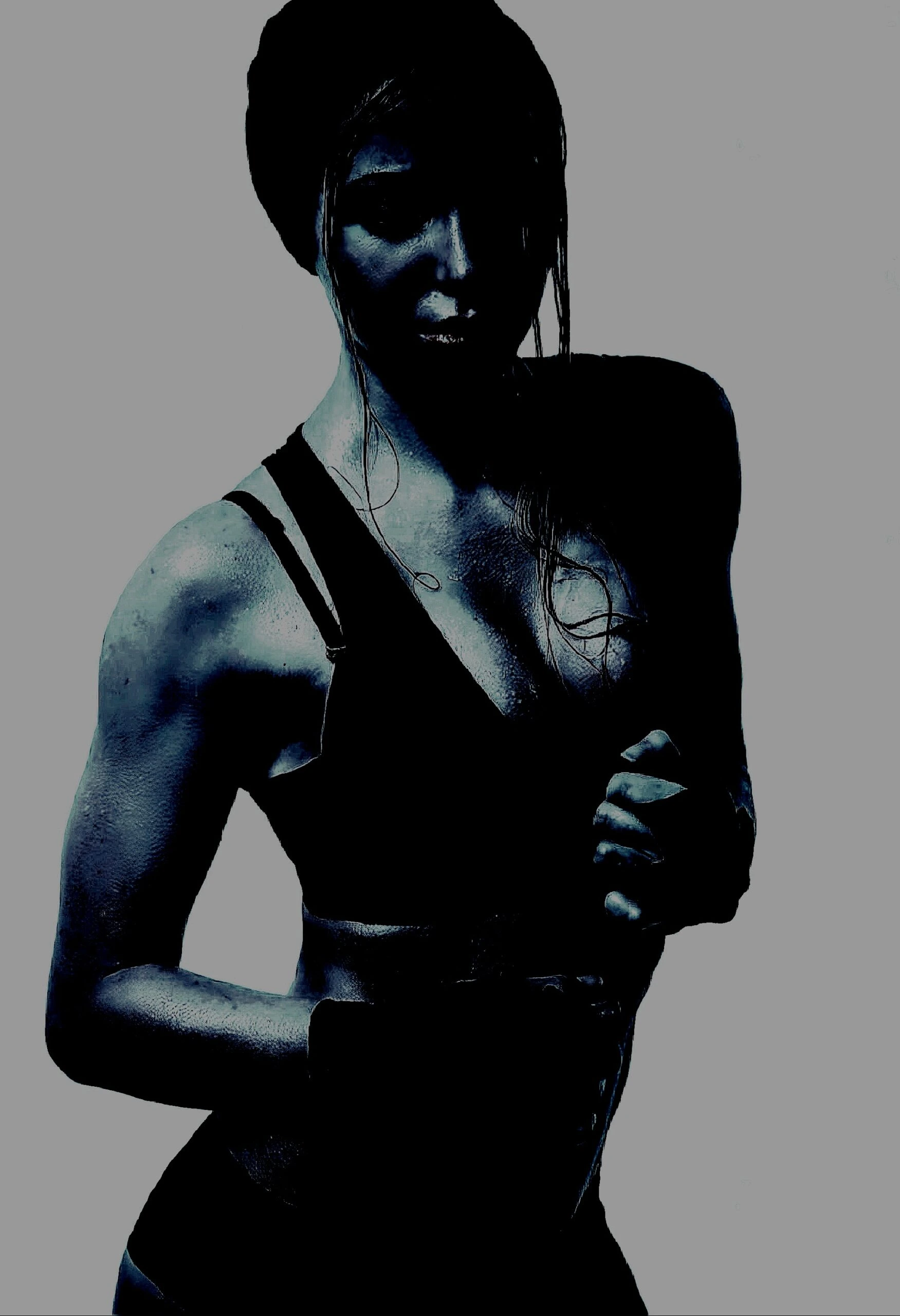Woman posing confidently in a workout outfit, illustrating the confidence inspired by Heavy Metal Yoga