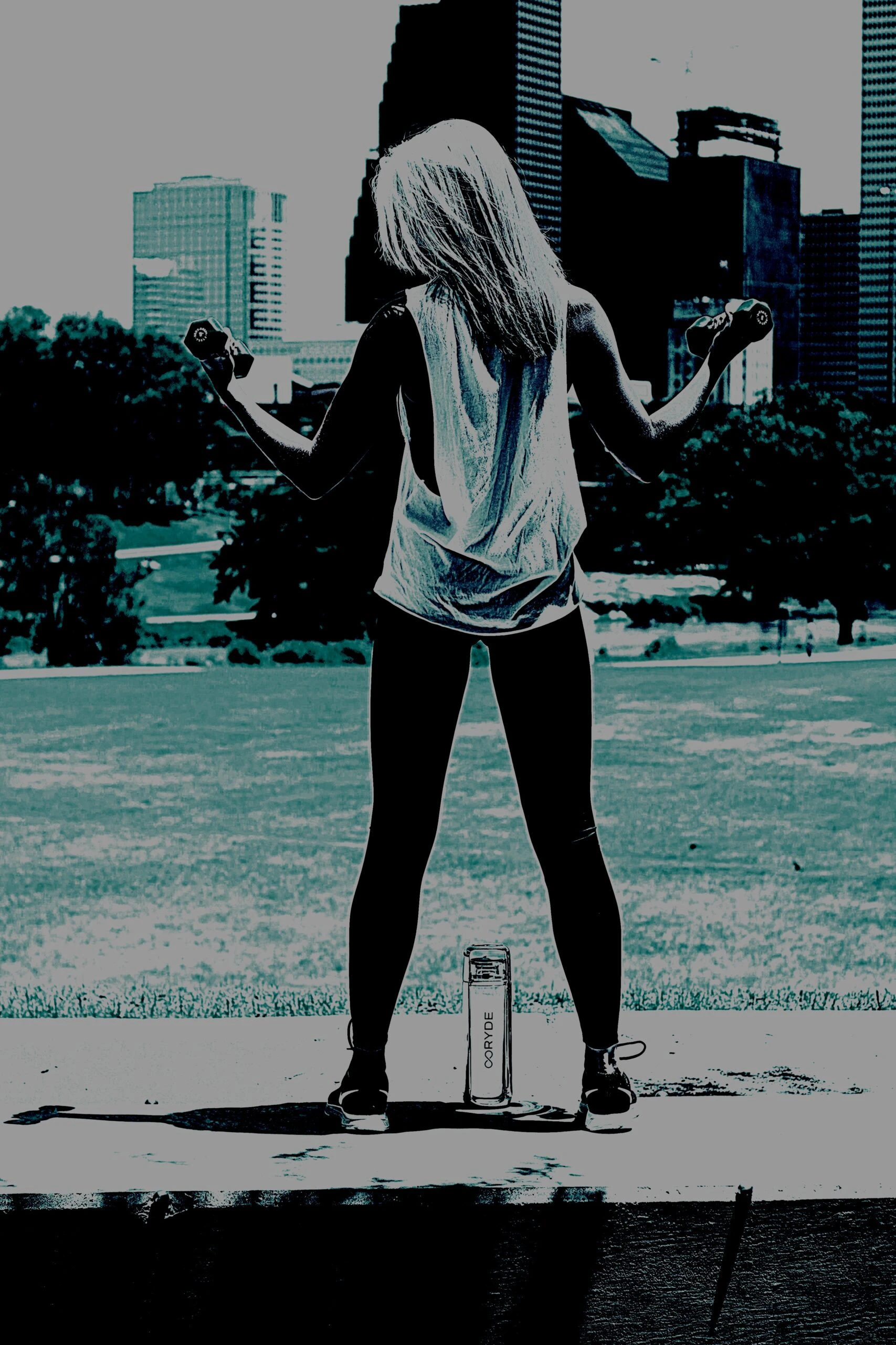 Woman lifting weights in an outdoor setting, embodying the spirit of Heavy Metal Yoga