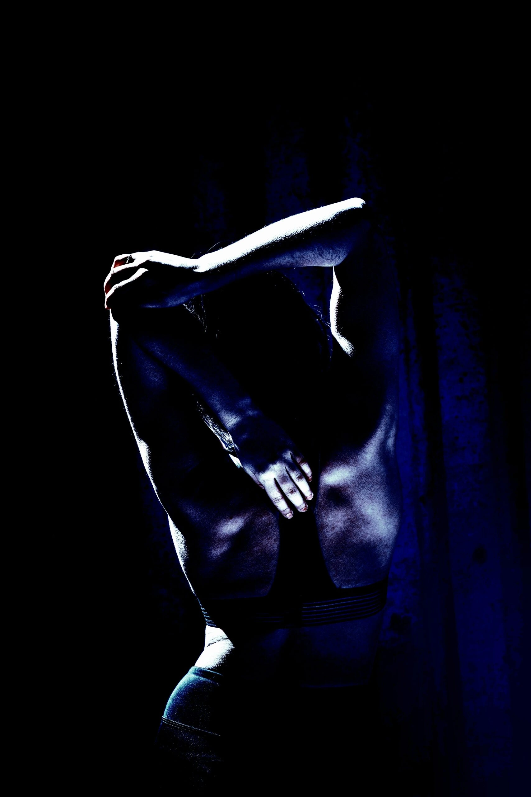 Woman in athletic wear preparing for a workout in an urban environment, symbolizing Heavy Metal Yoga