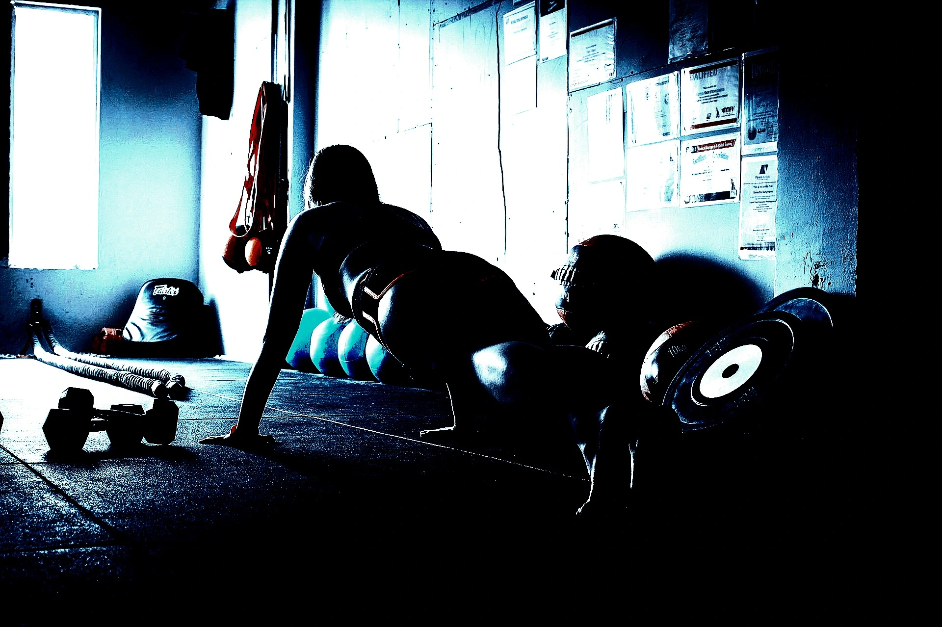 Woman performing a plank exercise, reflecting the strength and balance of Heavy Metal Yoga