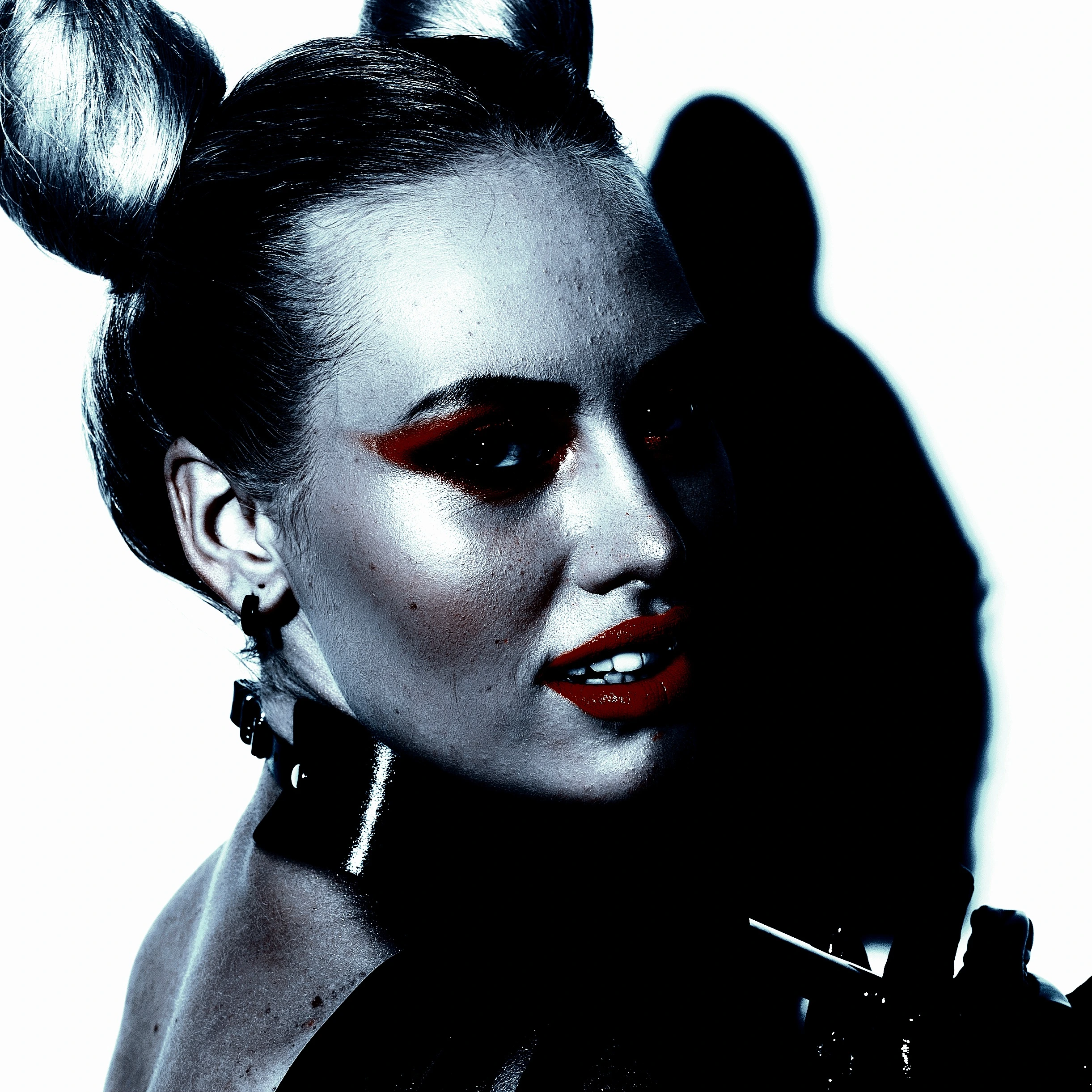 A woman with dramatic makeup and BDSM collar, symbolizing the complex interplay of physical and emotional responses in BDSM pain processing.