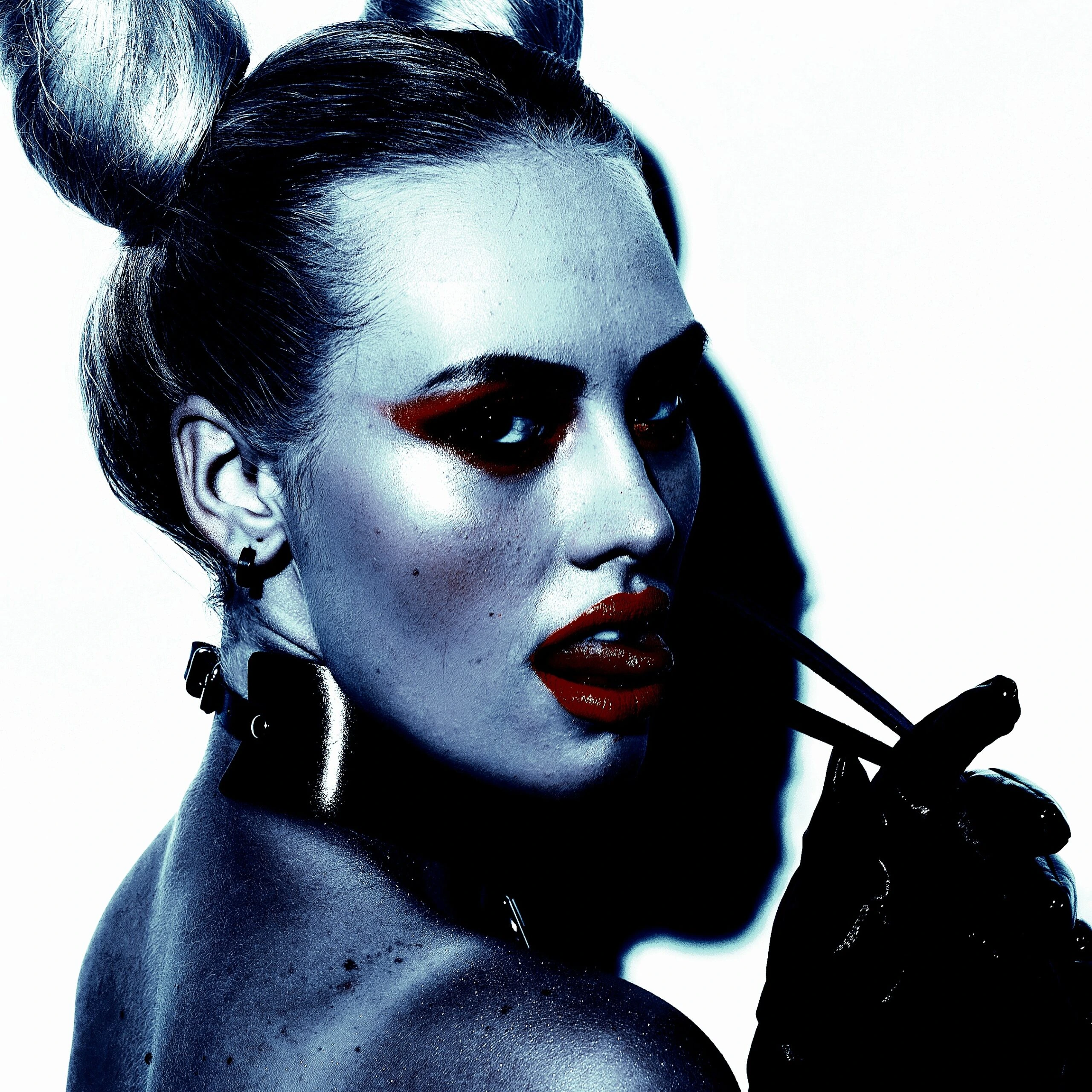 A woman with bold makeup and a BDSM collar, embodying the psychological and emotional aspects of BDSM extreme pain processing.