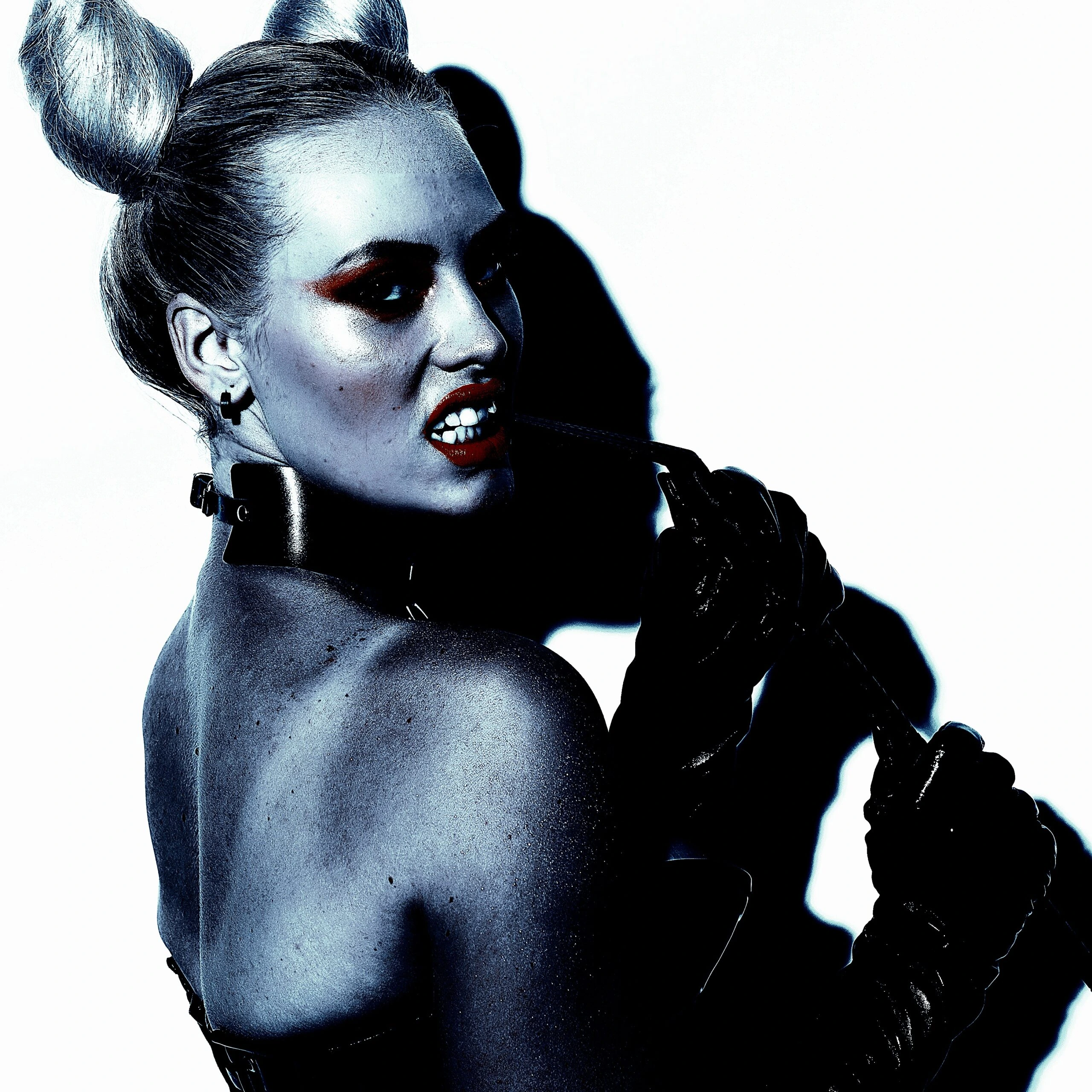 A woman in BDSM attire, demonstrating the physical and psychological dynamics of pain in BDSM.