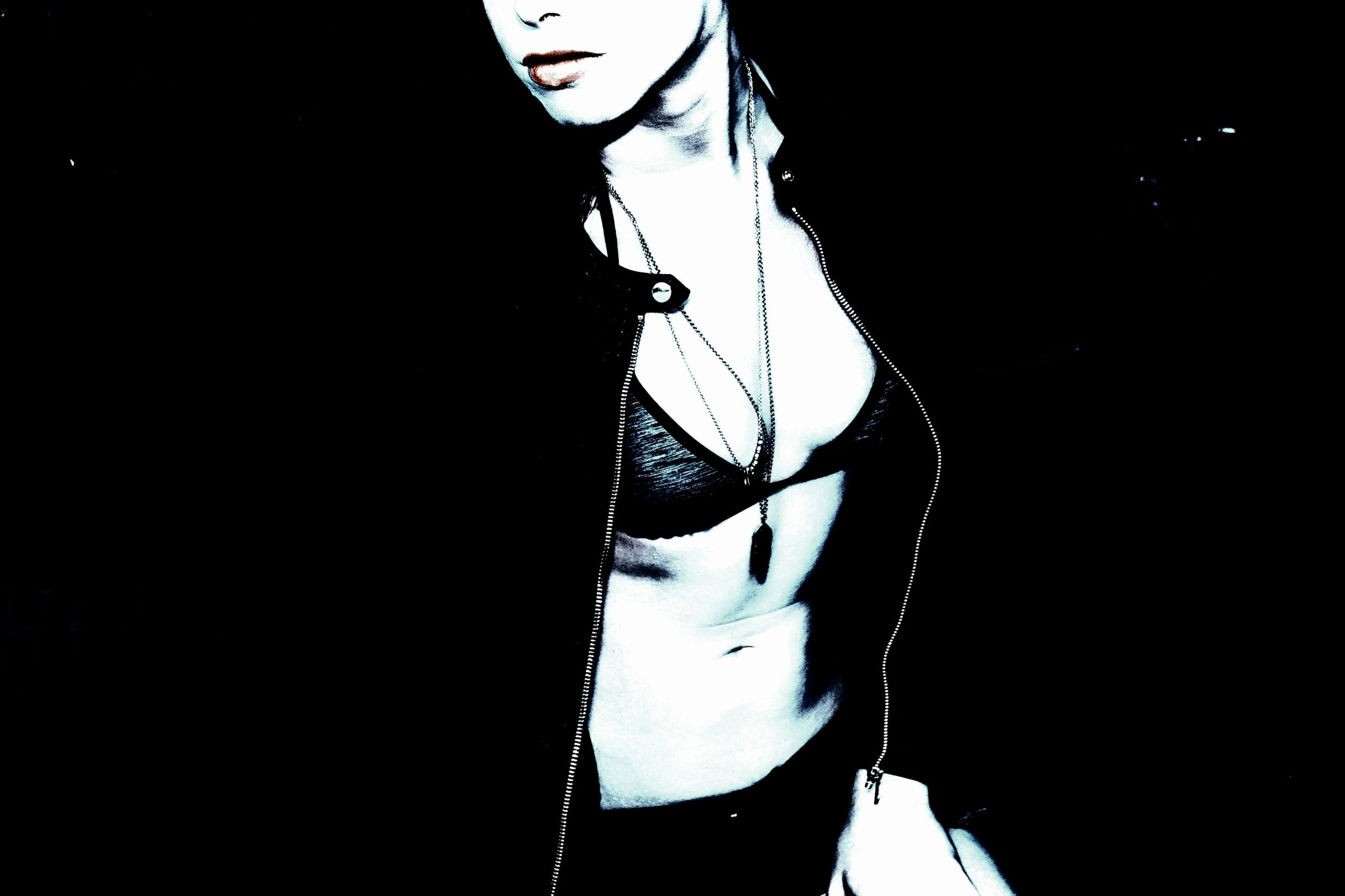 Close-up of a person in a leather jacket, highlighting BDSM practices and fashion.