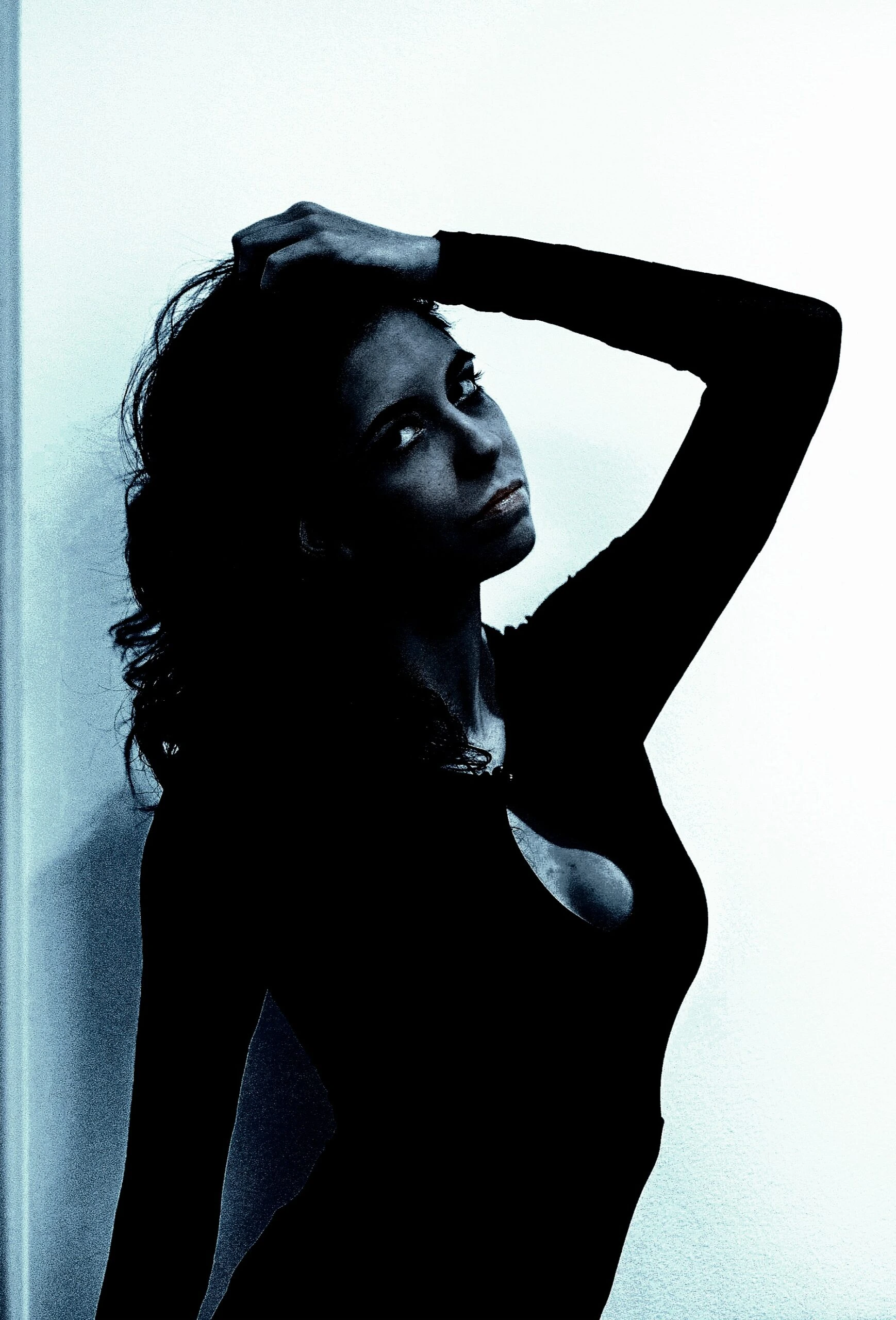 Woman in a black dress, expressing the sensuality of BDSM sexual activities.
