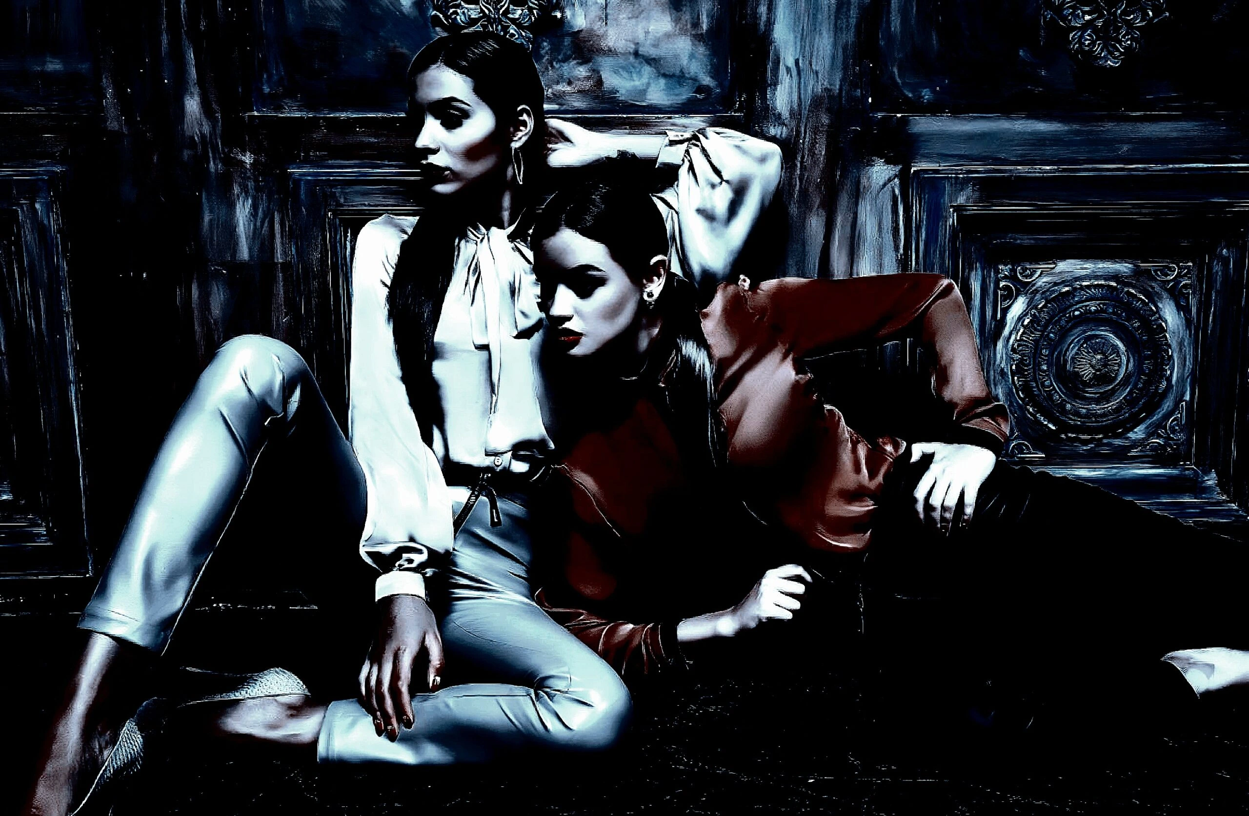Two fashionable women posing against an ornate dark wooden background, one seated and the other leaning