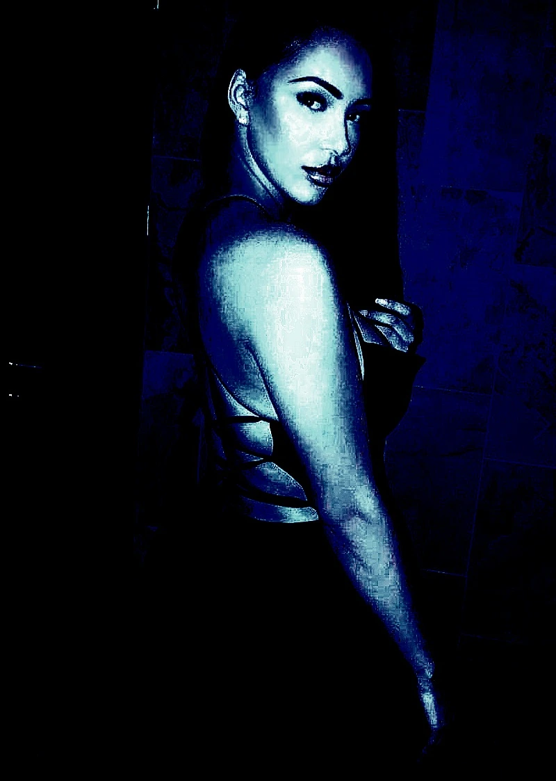 Gothic woman in a dark dress with a backless design