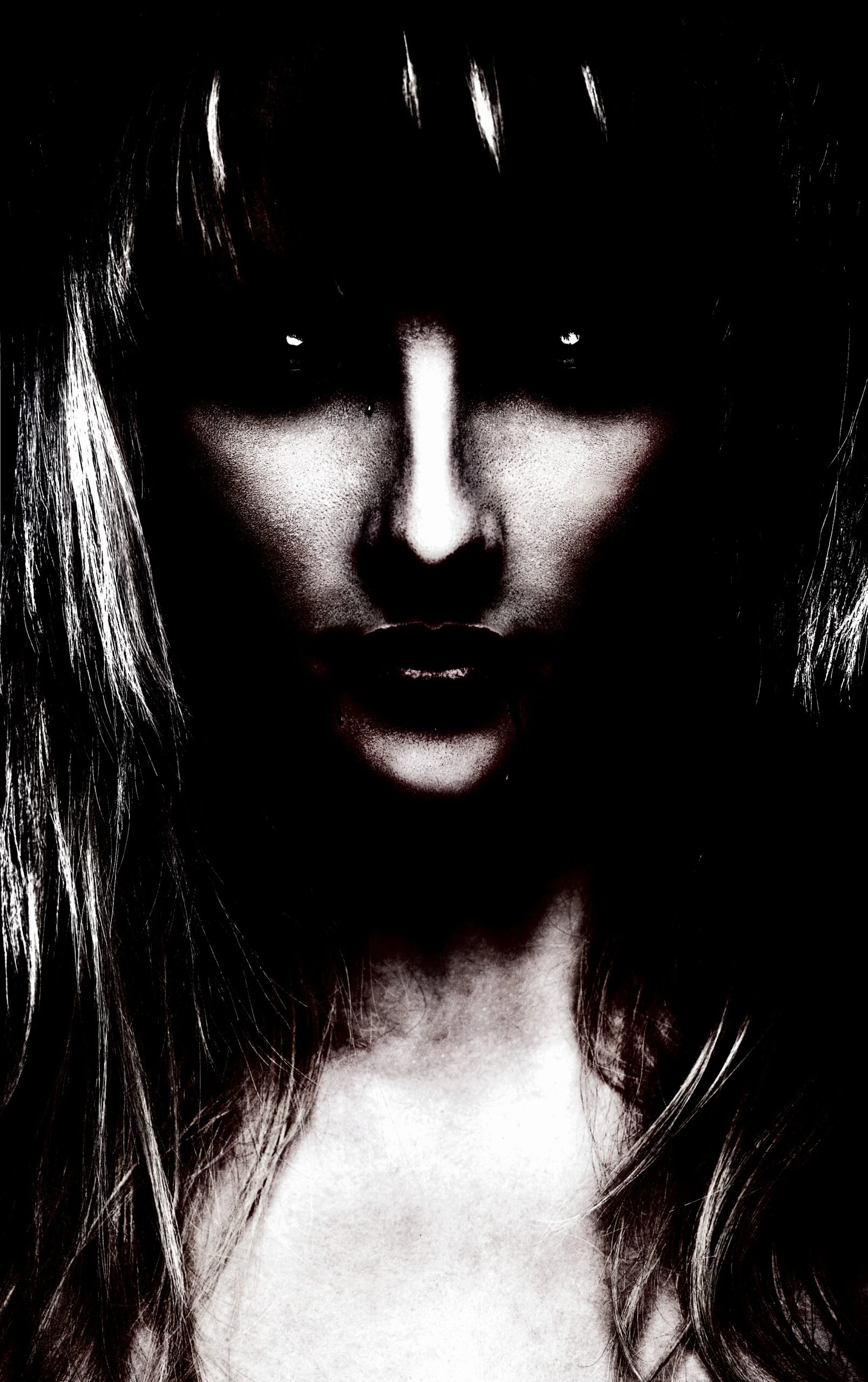 Mysterious woman with shadowed face and piercing eyes, dressed in vampire goth velvet attire.