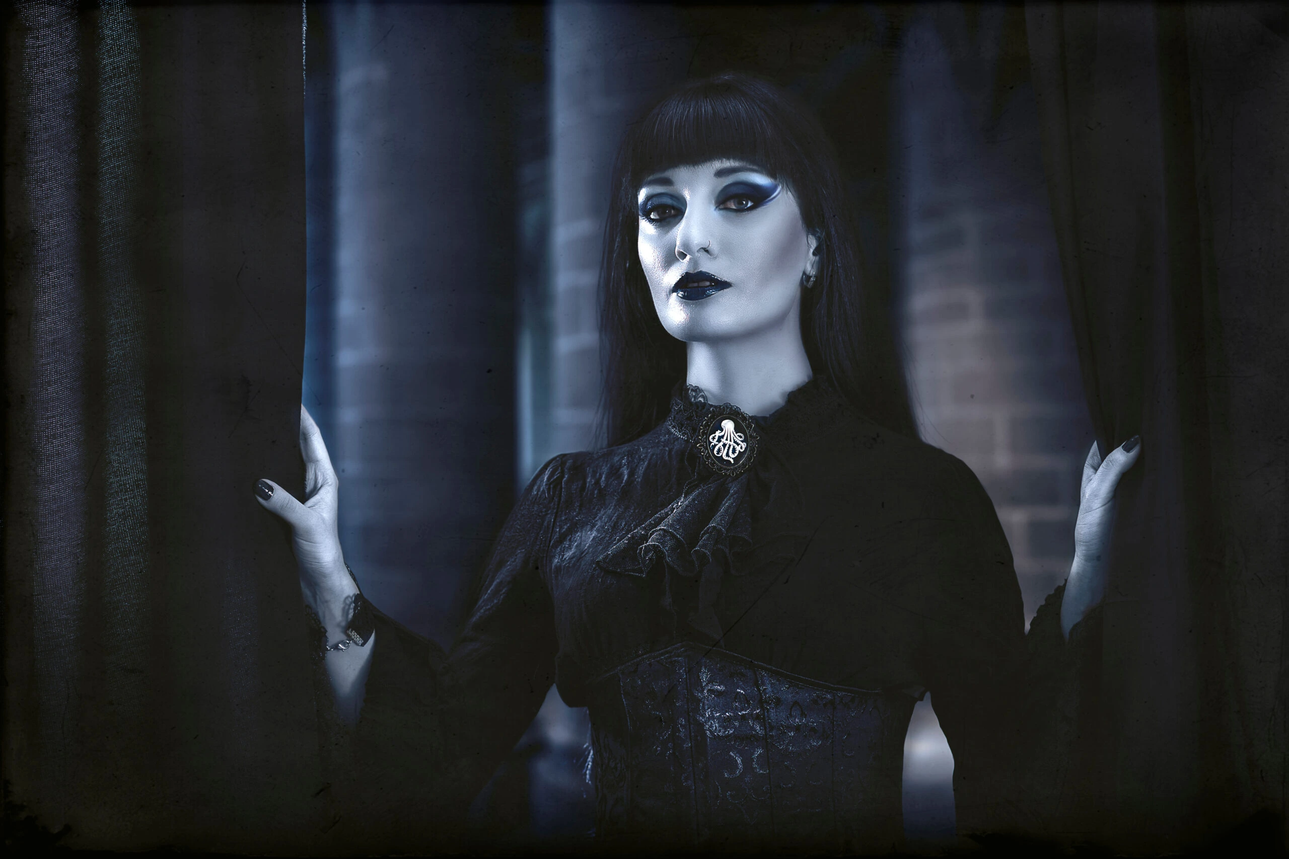 Gothic woman in dark Victorian-inspired attire, standing ominously behind a curtain with a haunting expression.