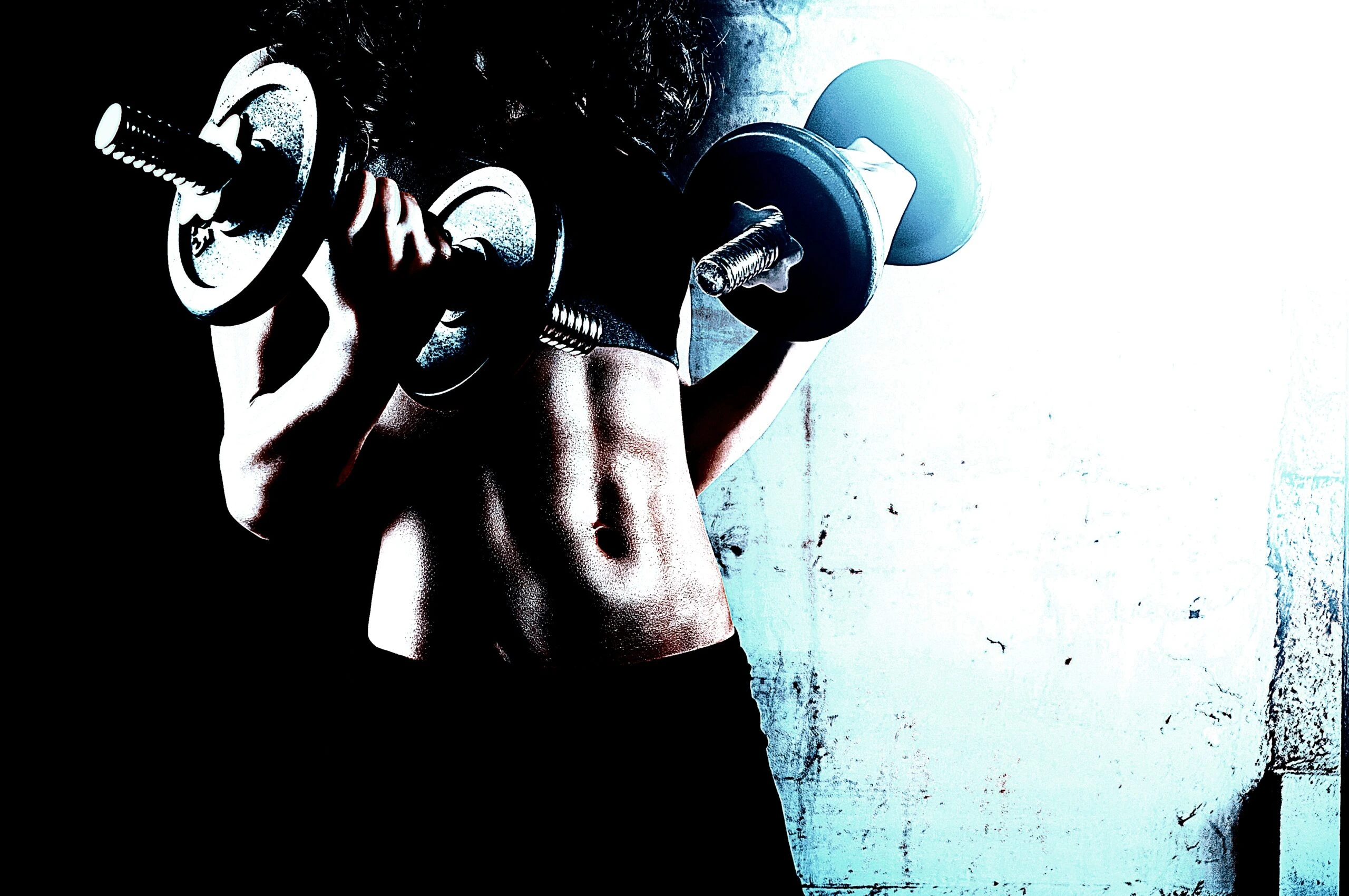 Woman with tattoos and chains on her back standing against a grungy background