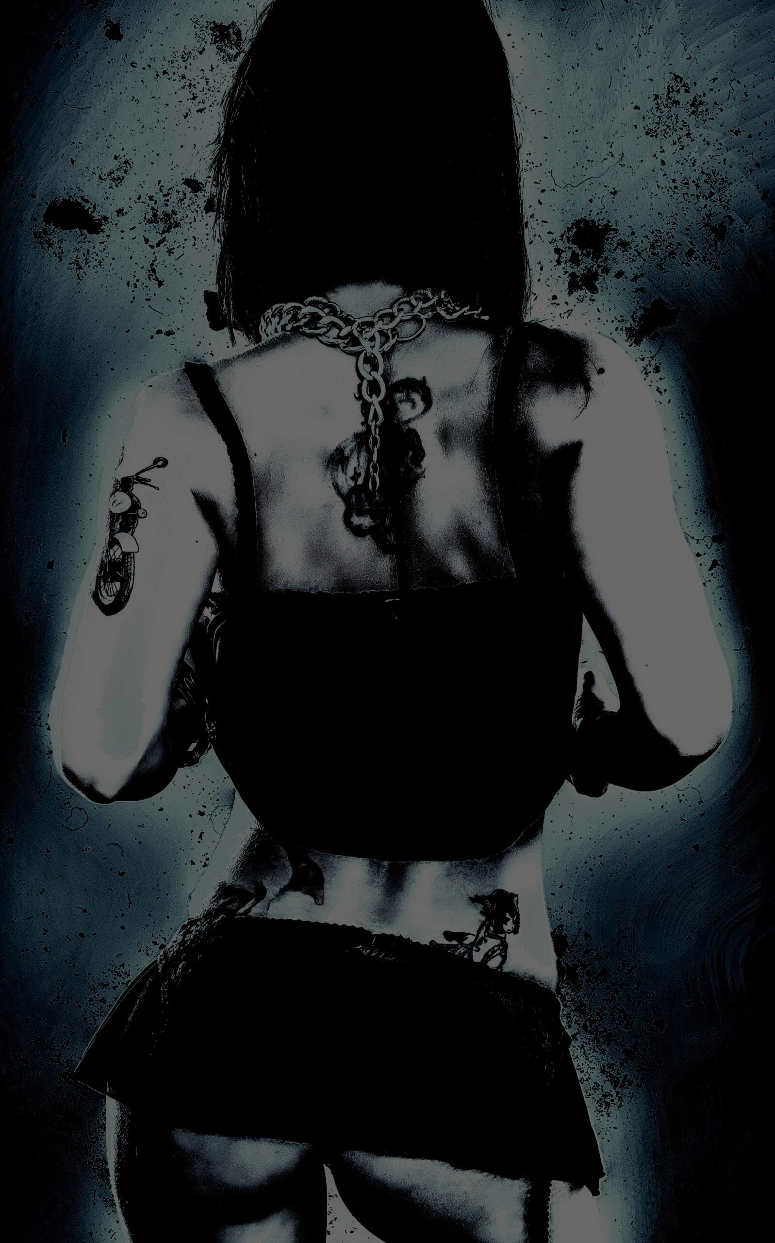 Athletic woman in a bright sports bra posing in a dark studio with dramatic lighting