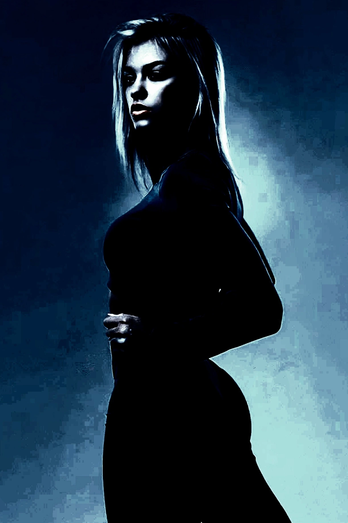 Moody silhouette of a woman in dark attire with striking lighting on her face and body.
