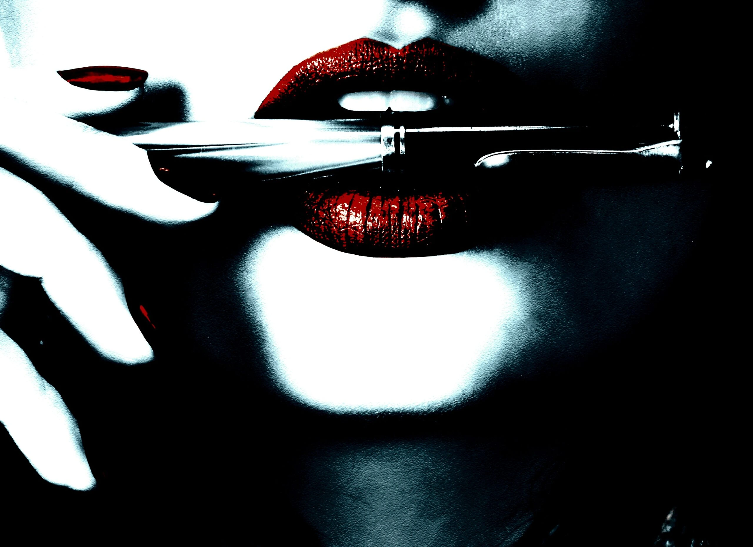 Woman's lips with red lipstick holding a pen horizontally.