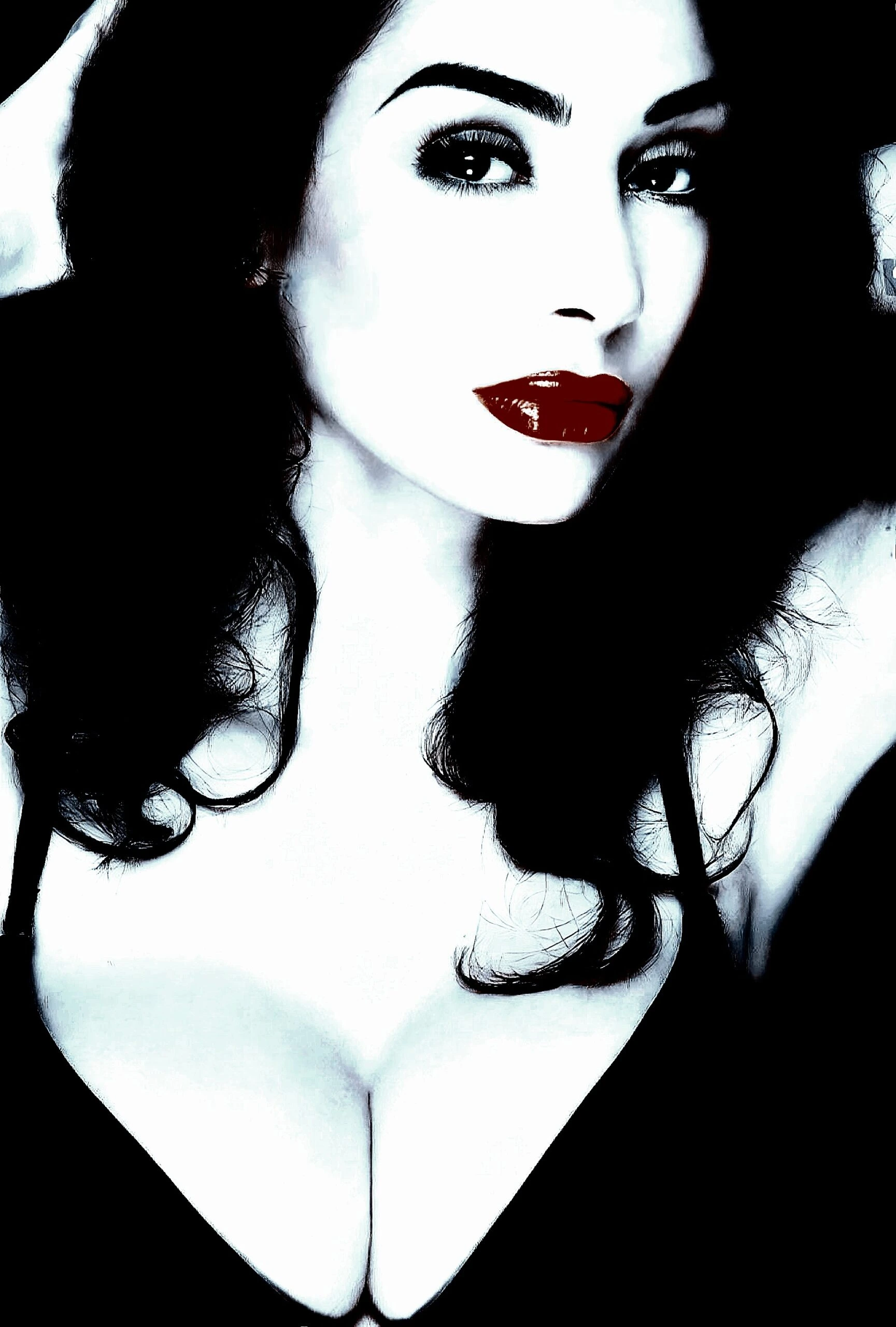Close-up of a woman with deep red lips, dark hair, and sultry eyes, exuding a classic femme fatale allure.