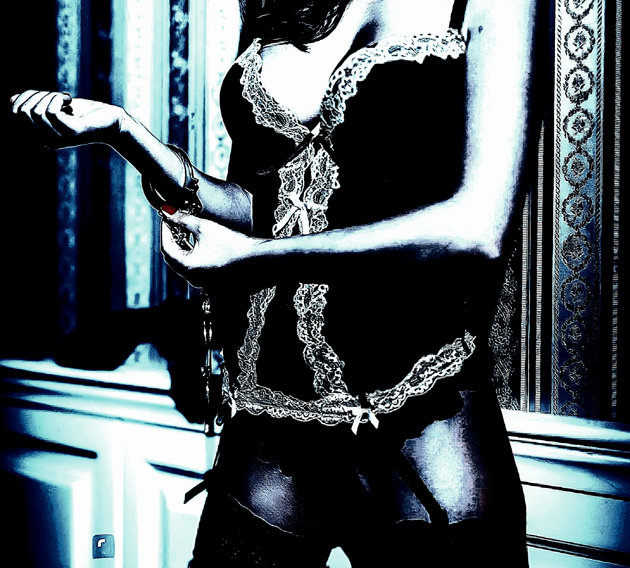 A woman in a black lace bodysuit holding a handcuff, emphasizing sensuality and intrigue.