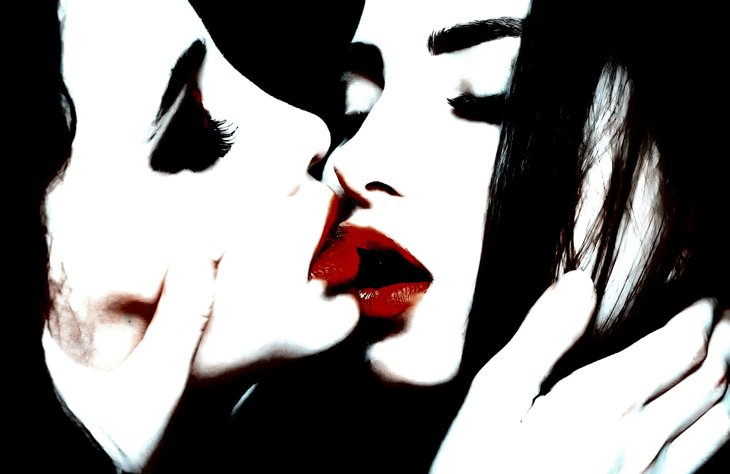 Two individuals sharing an intimate kiss, capturing a moment of closeness and tenderness.