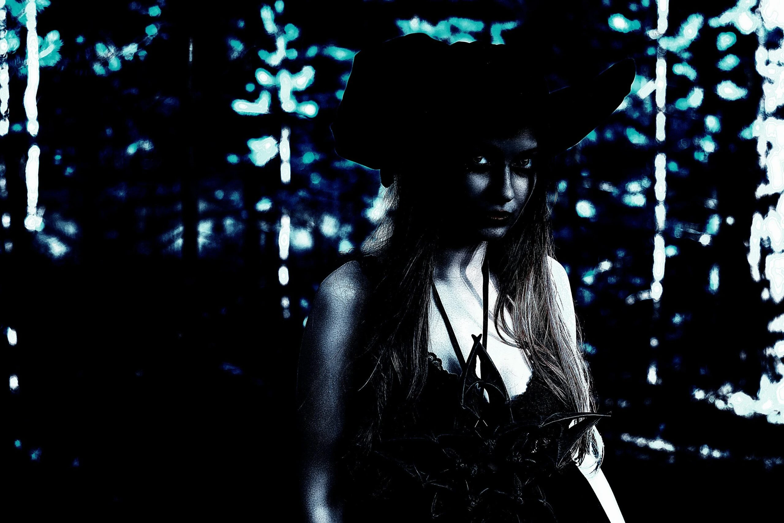 Mysterious woman in gothic attire and a black hat, standing against a dark forest background with moody lighting.