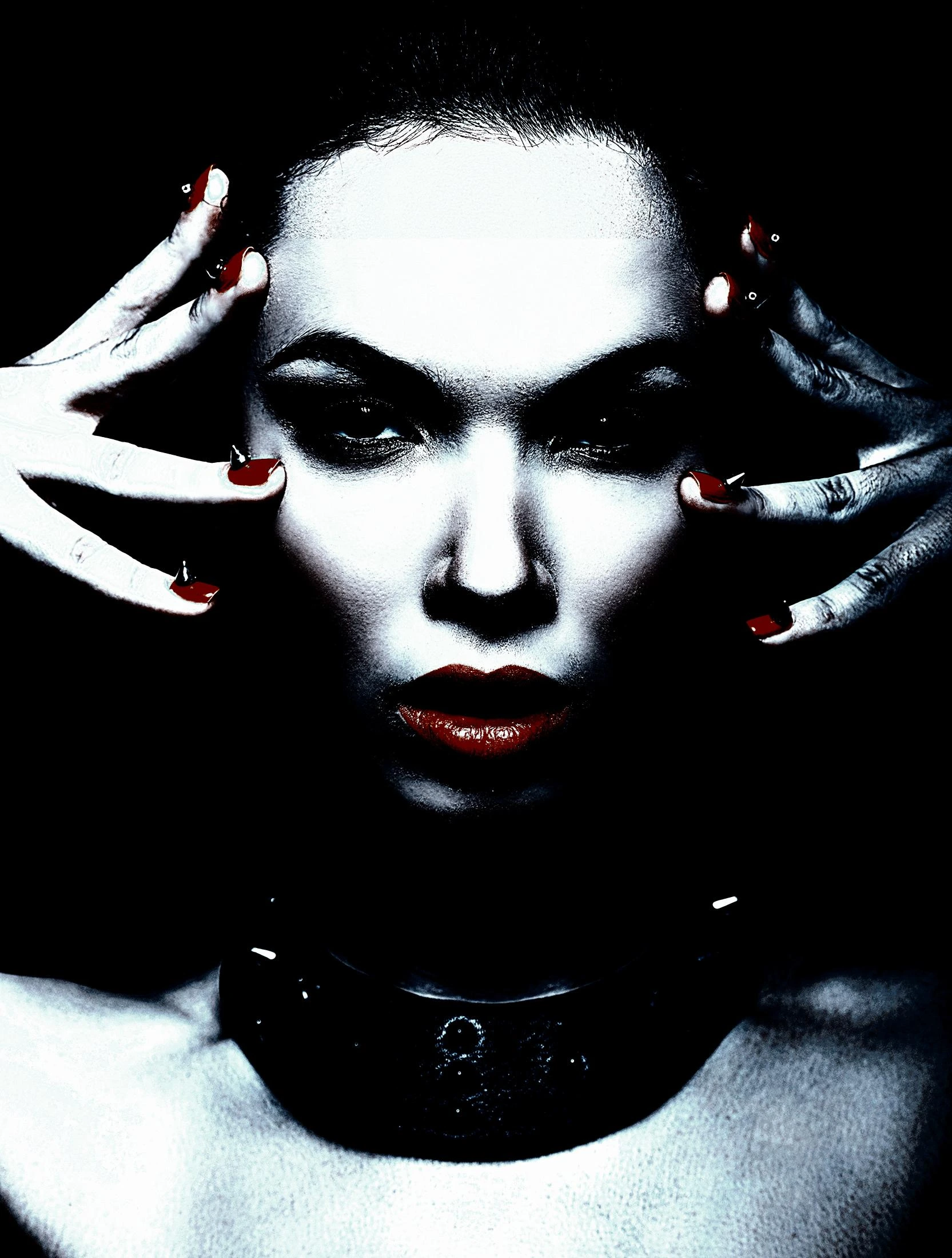 Gothic woman with dark lipstick and red nails, wearing a black leather collar in a high-contrast, dramatic style.