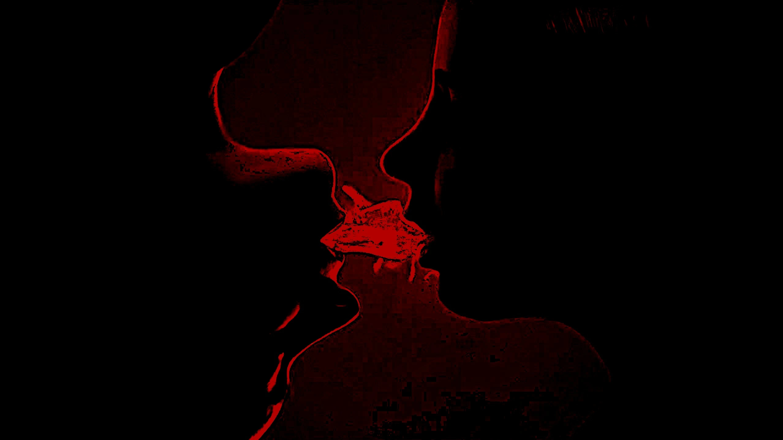 Silhouettes of two people about to kiss, with red highlights emphasizing the intensity of their connection against a dark background.