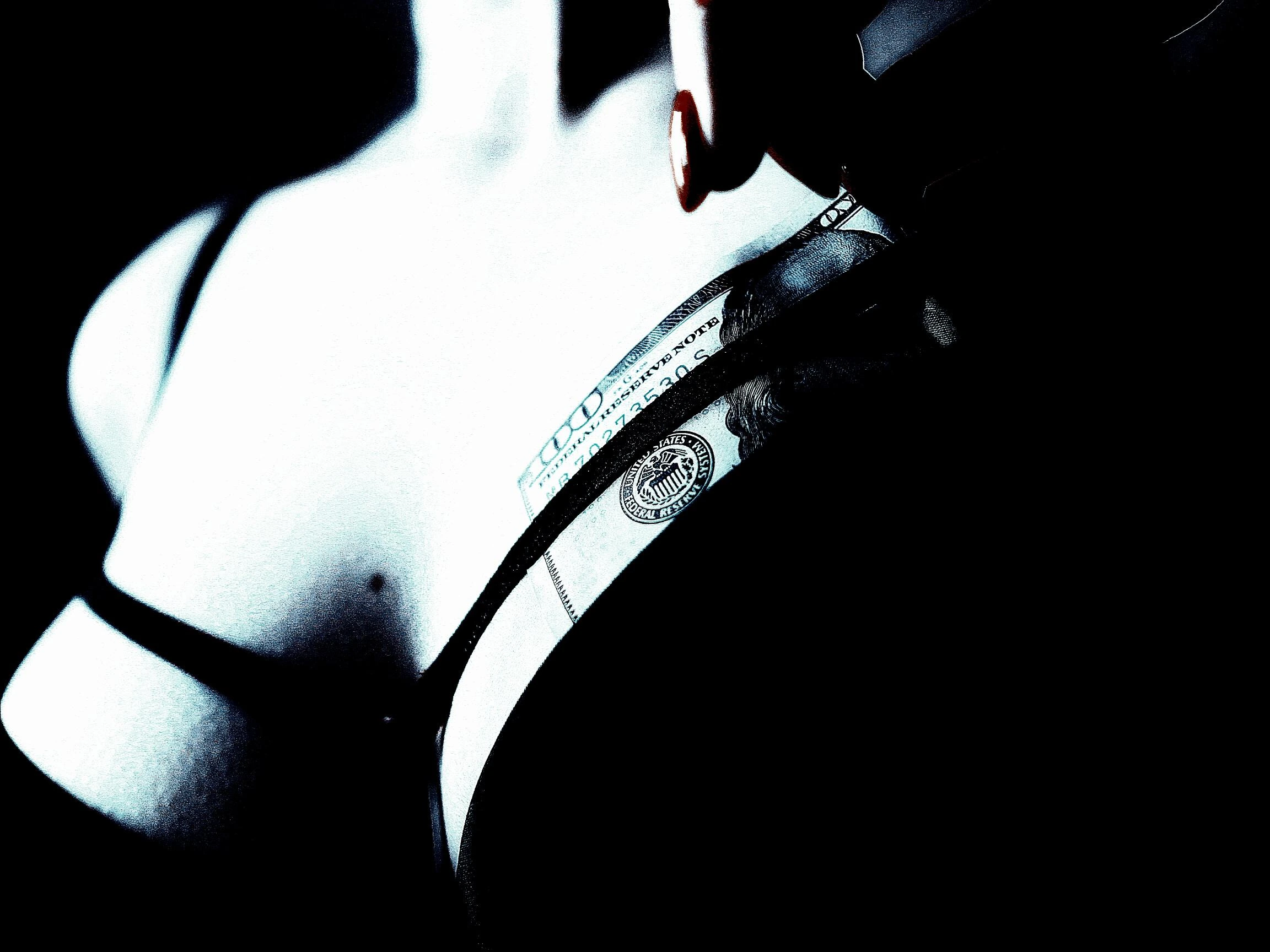 A stylized, high-contrast image of a woman slipping a hundred-dollar bill into her black bra.