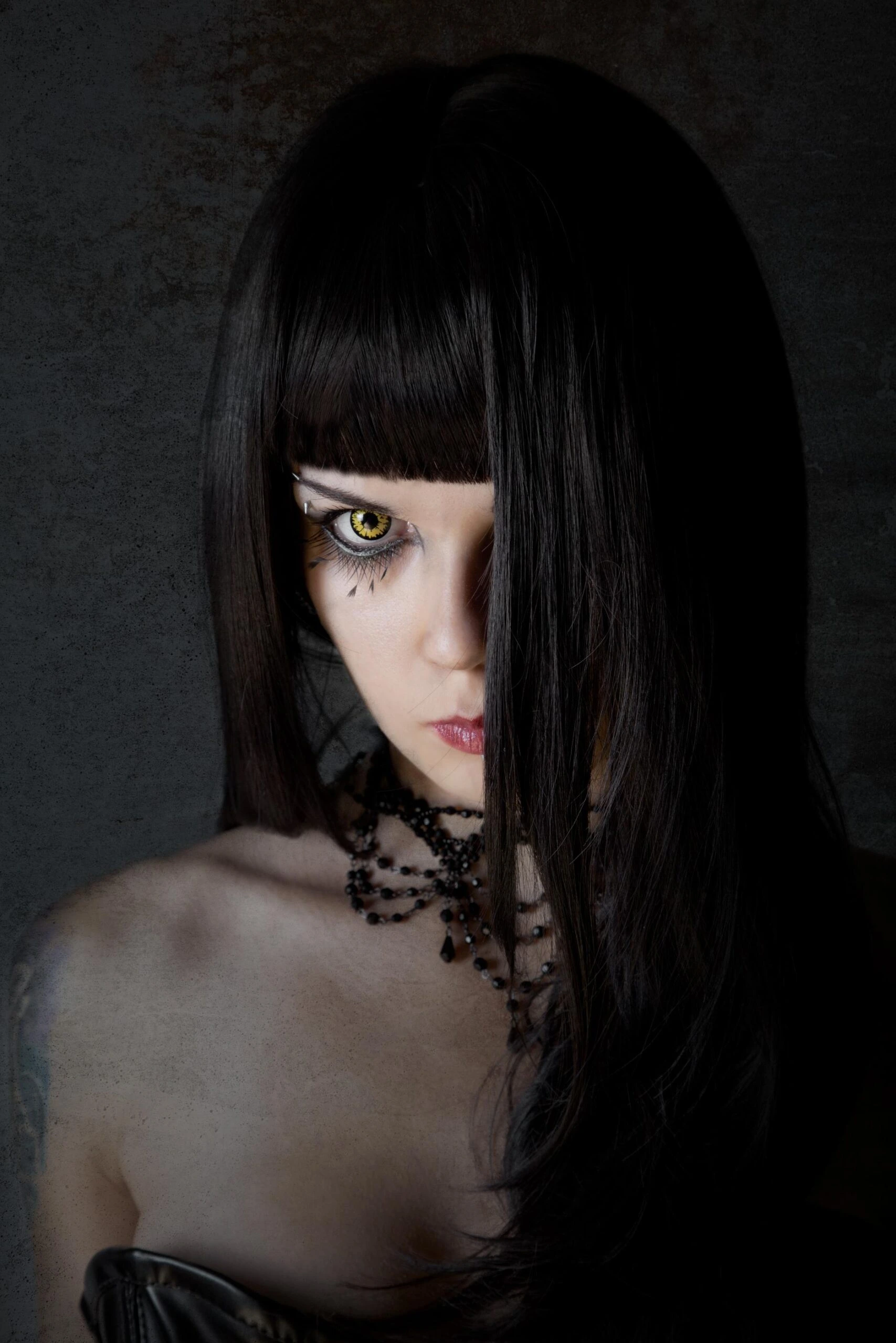 Mysterious gothic woman with piercing yellow eyes, wearing a choker necklace and framed by dark, moody lighting.