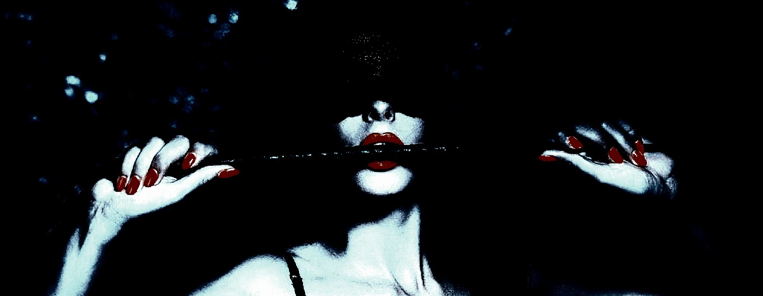 Gothic woman submerged in dark water, red lips, dramatic black-and-white aesthetic, alternative dark glamour.